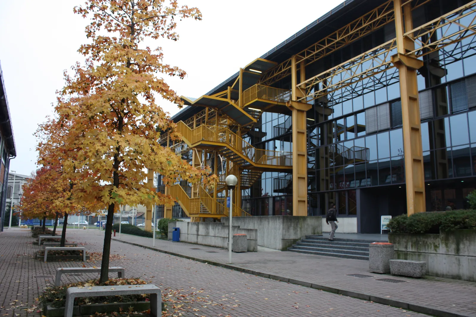 External staircases and glass facades at Politecnico di Milano's Bovisa campus in autumn